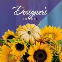 Sunflower arrangement with a decorative pumpkin centerpiece