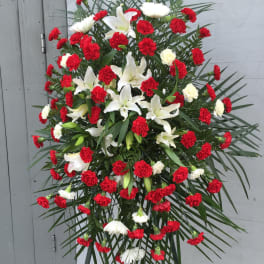 Standing floral spray with red carnations and white lilies