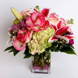 Pink and white mixed bouquet in a clear glass vase