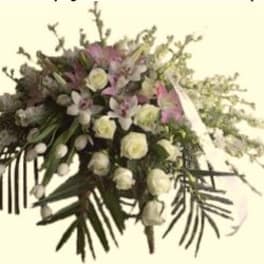 Large white and pink floral spray with cascading greenery