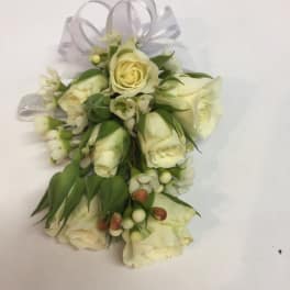 Small white rose corsage with ribbon loops