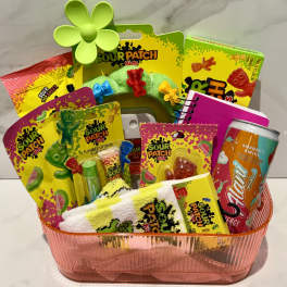 Gift basket with Sour Patch Kids candy, a can, and small accessories