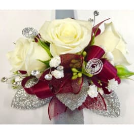 Bouquet of white roses with burgundy ribbon and silver accents