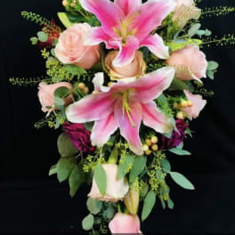 Bridal bouquet with pink lilies and pale roses