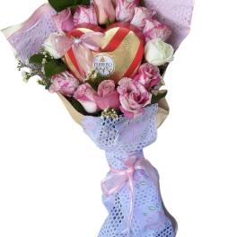 Pink and white rose bouquet with a heart-shaped chocolate box