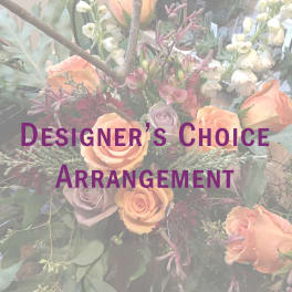 Mixed floral arrangement with peach roses and lavender blooms