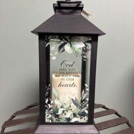 Black memorial lantern with a candle and floral print
