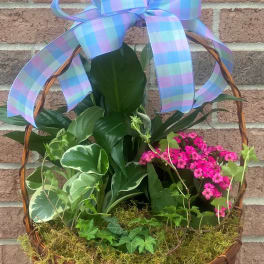 Basket planter with pink flowers and a pastel plaid bow