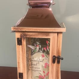 Wooden memorial lantern with a hummingbird design and a candle inside