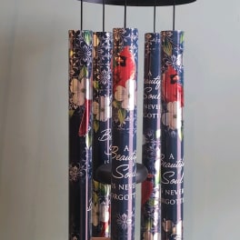 Hanging wind chime with floral and cardinal-print tubes