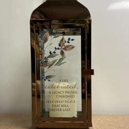 Bronze lantern with a memorial quote card inside
