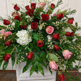 Large floral spray with red and pink roses and white blooms