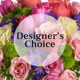 Mixed bouquet of pink roses and purple flowers with green accents