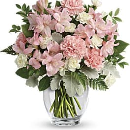 Pink and white mixed bouquet in a clear glass vase