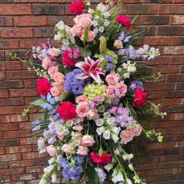 Large standing floral spray with pink roses and lilies