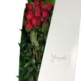 Bouquet of red roses in a white gift box