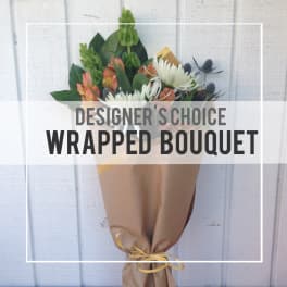 Wrapped bouquet with white daisies and orange alstroemeria