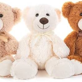 Three plush teddy bears in beige, white, and brown with bows
