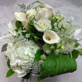 White bouquet with roses, calla lilies, and hydrangea