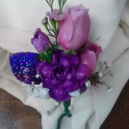 Small bouquet of pink and purple roses with glitter accents