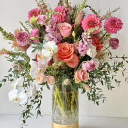 Pink and white mixed bouquet in a clear glass vase