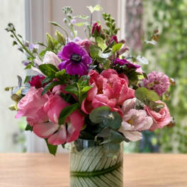 Pink and purple mixed bouquet in a glass vase