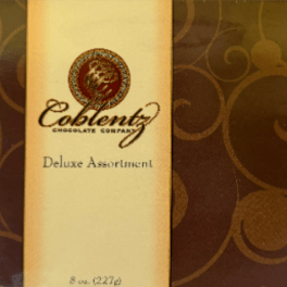 Box of assorted chocolates with a gold label