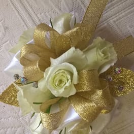 White rose corsage with gold ribbon and glitter accents