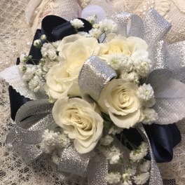 Cream rose bouquet with silver and navy ribbon accents