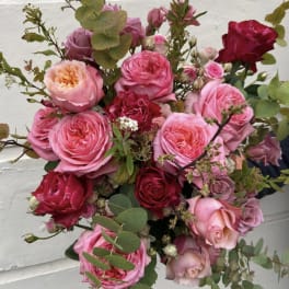 Bouquet of pink and red roses with eucalyptus