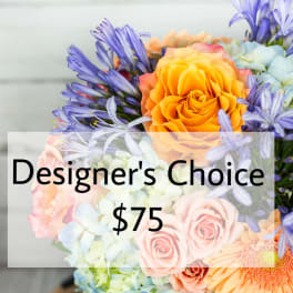 Mixed bouquet with orange roses, blue hydrangeas, and purple flowers