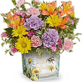 Colorful mixed bouquet in a painted glass vase