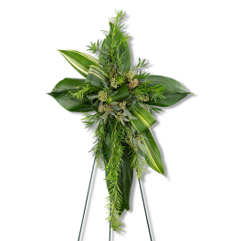 Green floral standing cross on an easel