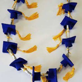 Blue and gold graduation lei made from folded bills and tassels