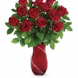 Red roses arranged in a red vase