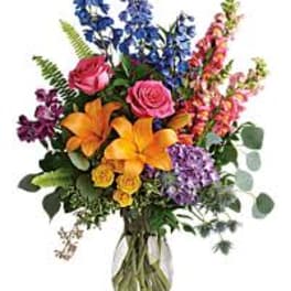 Colorful mixed bouquet in a clear glass vase