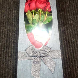 Box of red roses with a silver ribbon bow