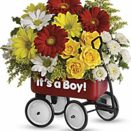 Bouquet of red, yellow, and white flowers in a baby wagon