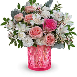 Pink and white bouquet in a bright pink textured vase