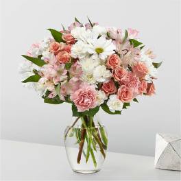 Pink and white mixed bouquet in a clear glass vase