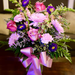 Pink and purple mixed bouquet with a satin ribbon