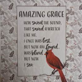 Decorative sign with a cardinal and the words "Amazing Grace"