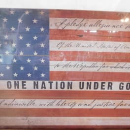 Framed American flag print with patriotic text