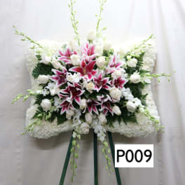 White and pink floral standing spray with lilies and roses