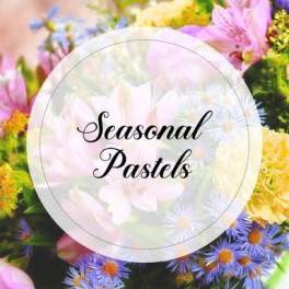 Close-up of a mixed bouquet of pastel pink, yellow, and lavender flowers with text reading Seasonal Pastels