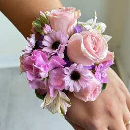 Pink rose and daisy wrist corsage with purple ribbon