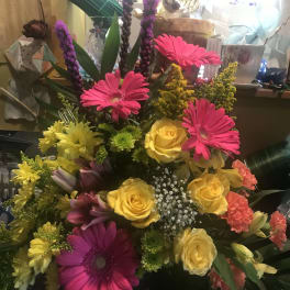 Bright mixed bouquet with pink gerbera daisies and yellow roses