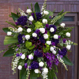 Large standing floral spray with white and purple flowers
