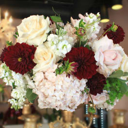 Bouquet of cream roses, burgundy dahlias, and white blooms