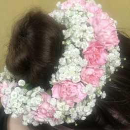 Pink flower crown on a person's head